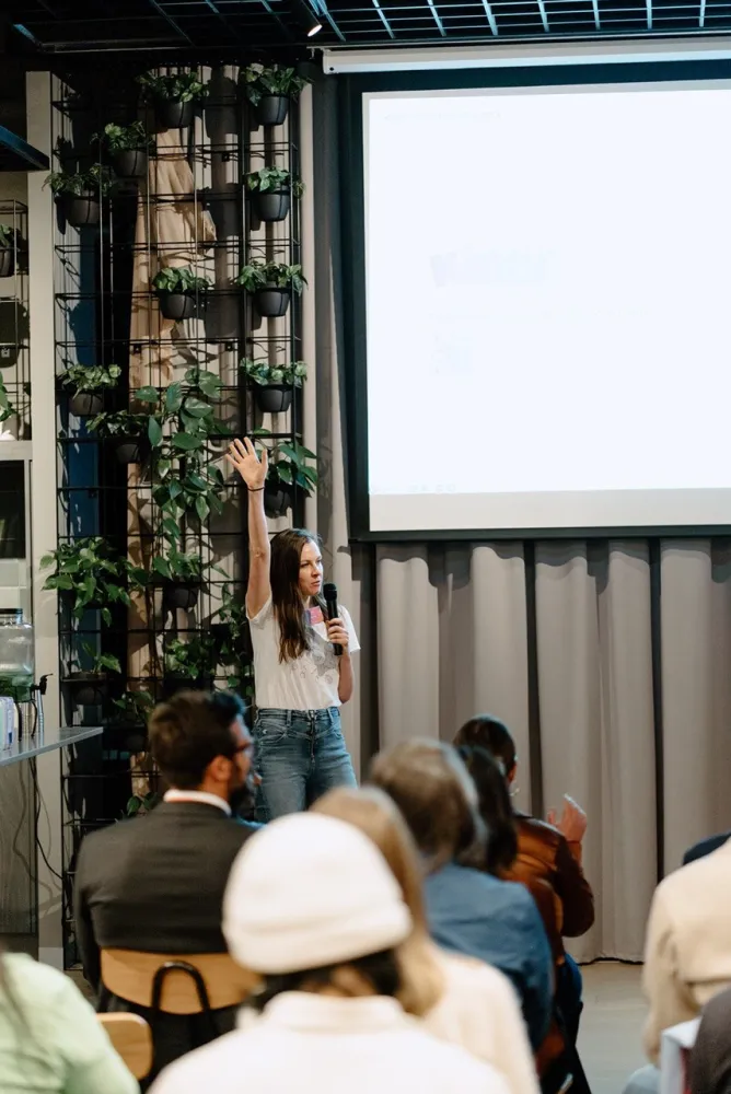 Anna Korol pitching the Kidly investor deck to an audience