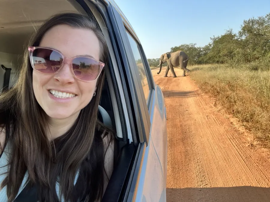 Anna Korol on safari watching an elephant cross the road, South Africa